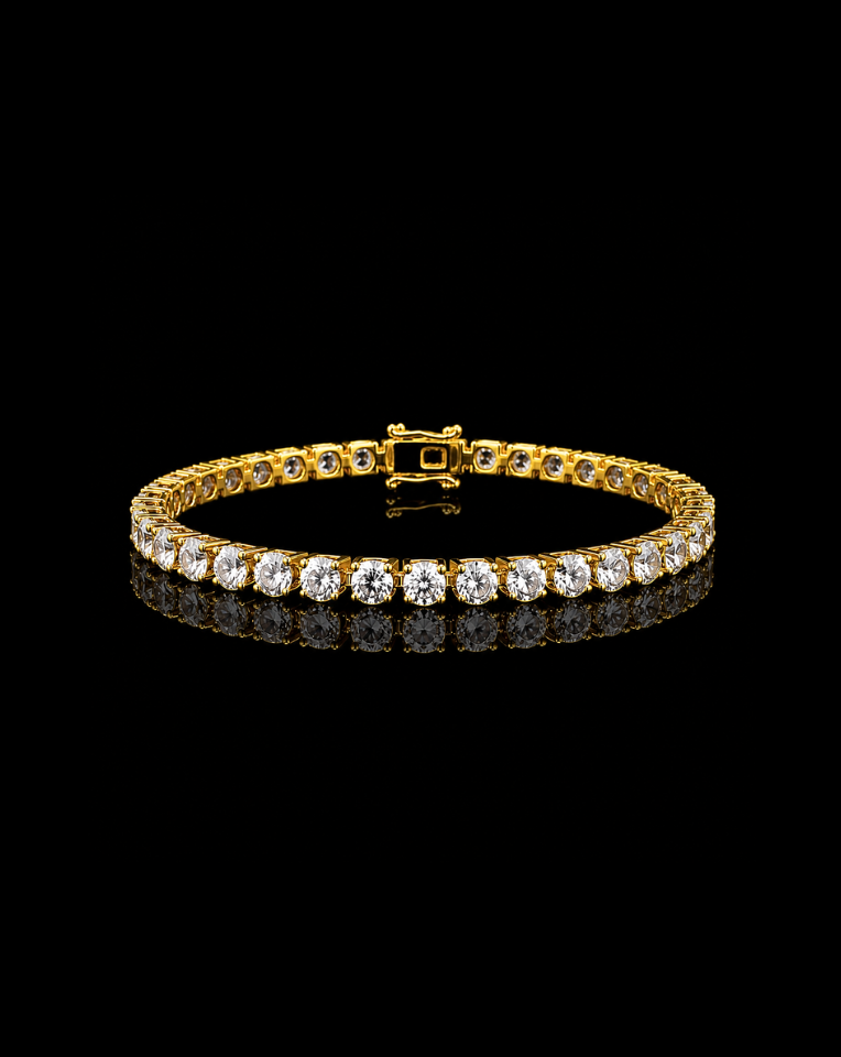 Gold 4mm tennis bracelet with crystals on a black background