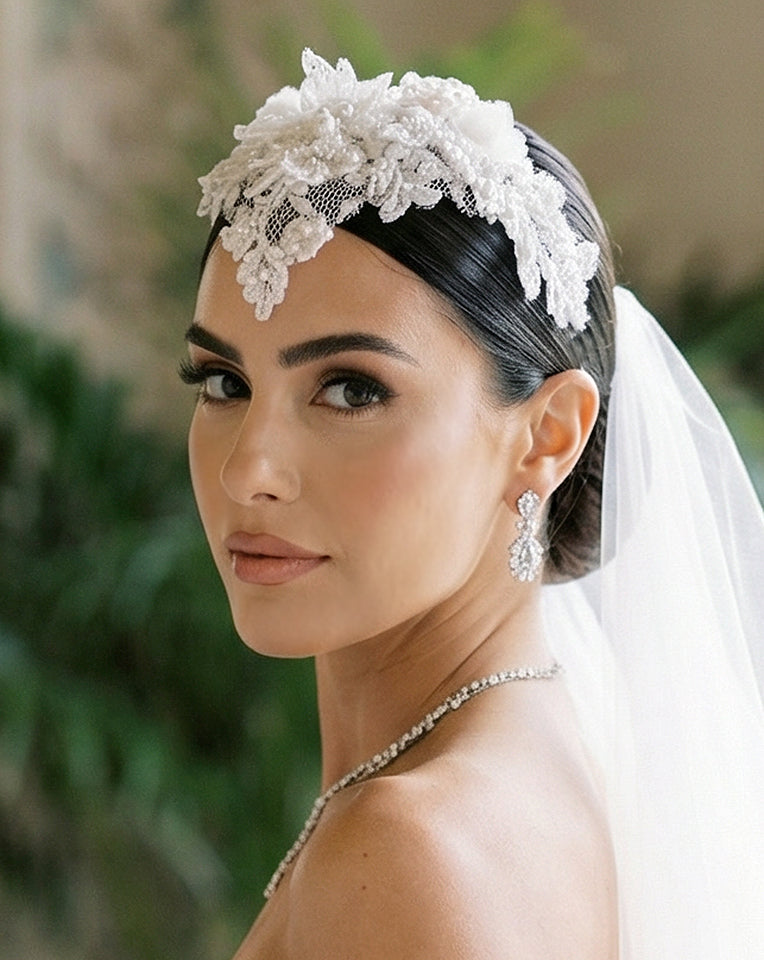 Bride wearing the Venetia couture 3D Chantilly lace bridal headpiece with pearl embellishment, photographed in a palatial villa — by Kezani Jewellery