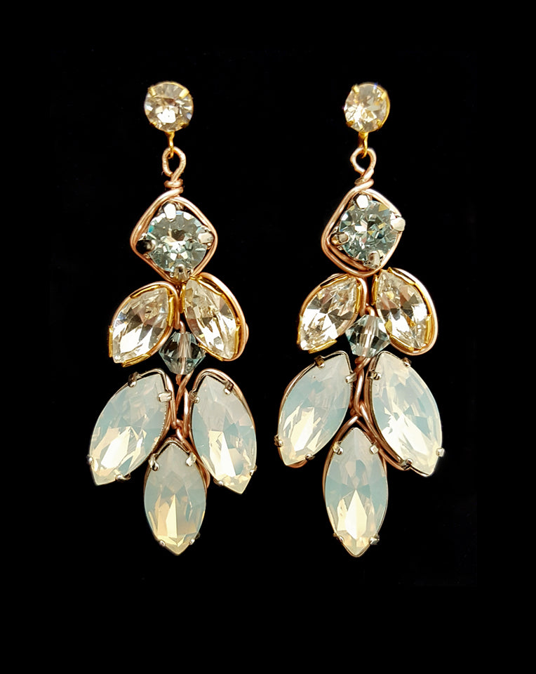 front on image of bridal earings white opal boho earing called pipa on black background by kezani jewellery