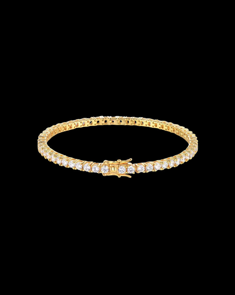 Gold bracelet with crystals on a black background