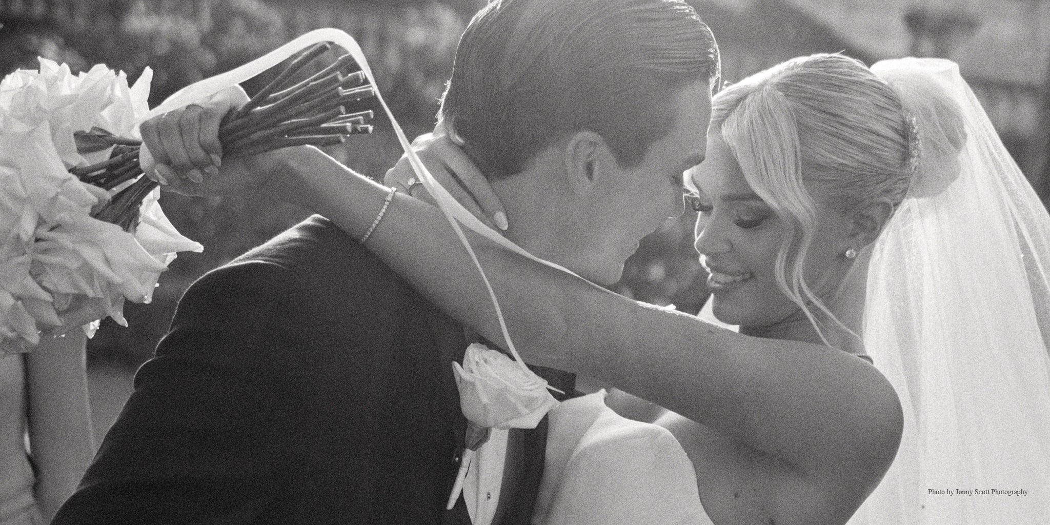 real weddings in perth - bride and groom holding each other. bride has a two tier veil with crystal headpiece
