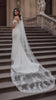 Rachael Veil long lace train flowing behind bride at cathedral ceremony