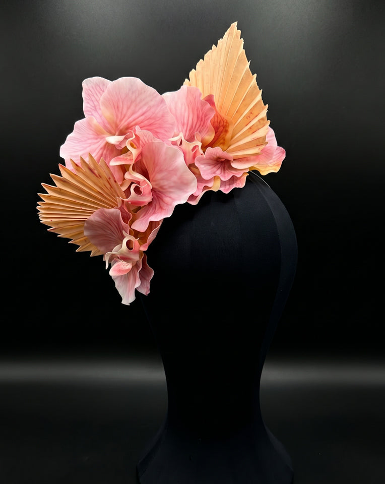 main headpiece of twin set of floral orchid fascinator in pink and ecru on black bacjkground