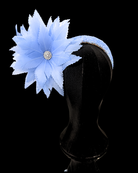 blue feather flower fascinator on mannequin with black background
