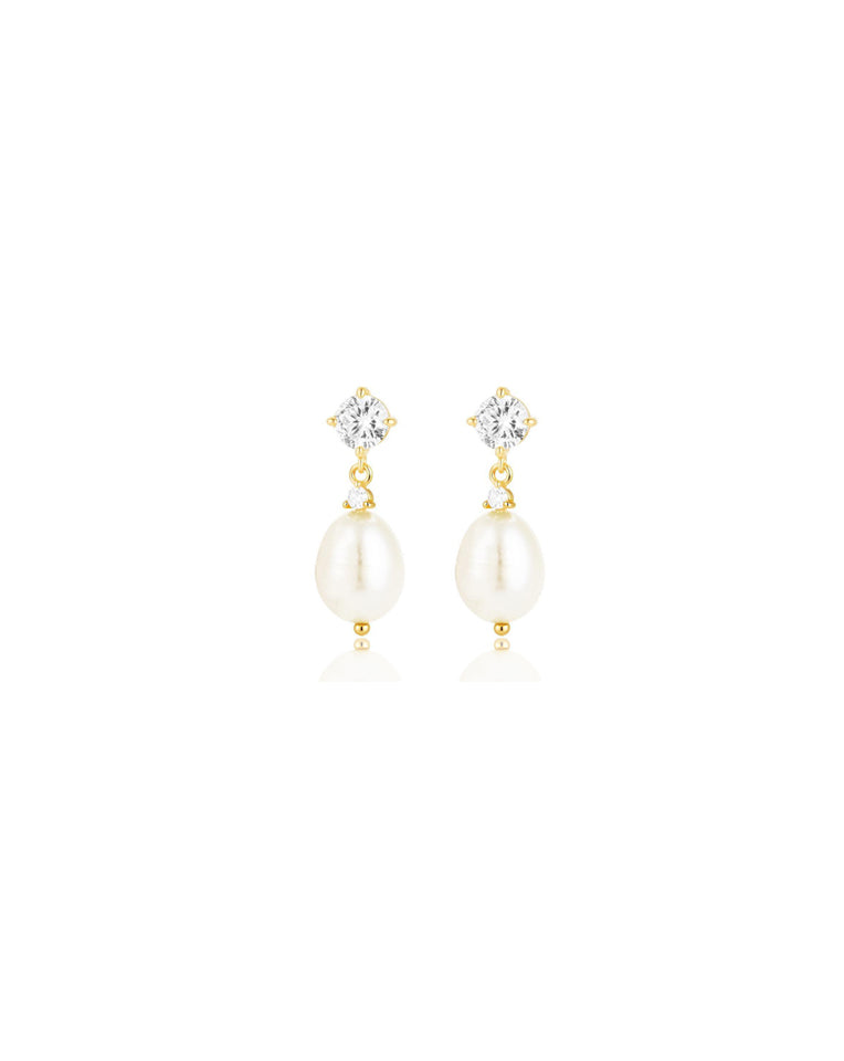 close up of dainty brooklyn earrings  in gold on white background - kezani jewellery