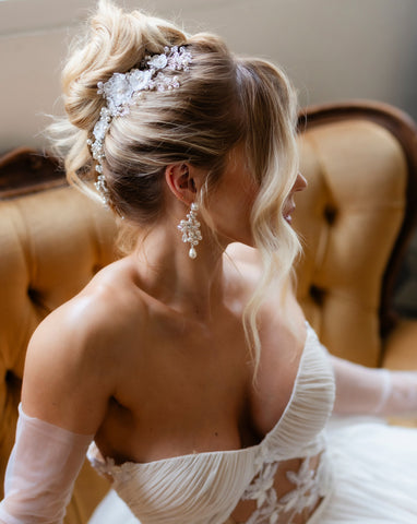 soft kim k updo with blonde hair - wearing pearl and lace luxury hair vine and pearl pin with pearl flower earrings - galia lahav gown and tulle gloves